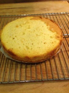 Slice off the top of each layer of the cake to create a smooth, even layer